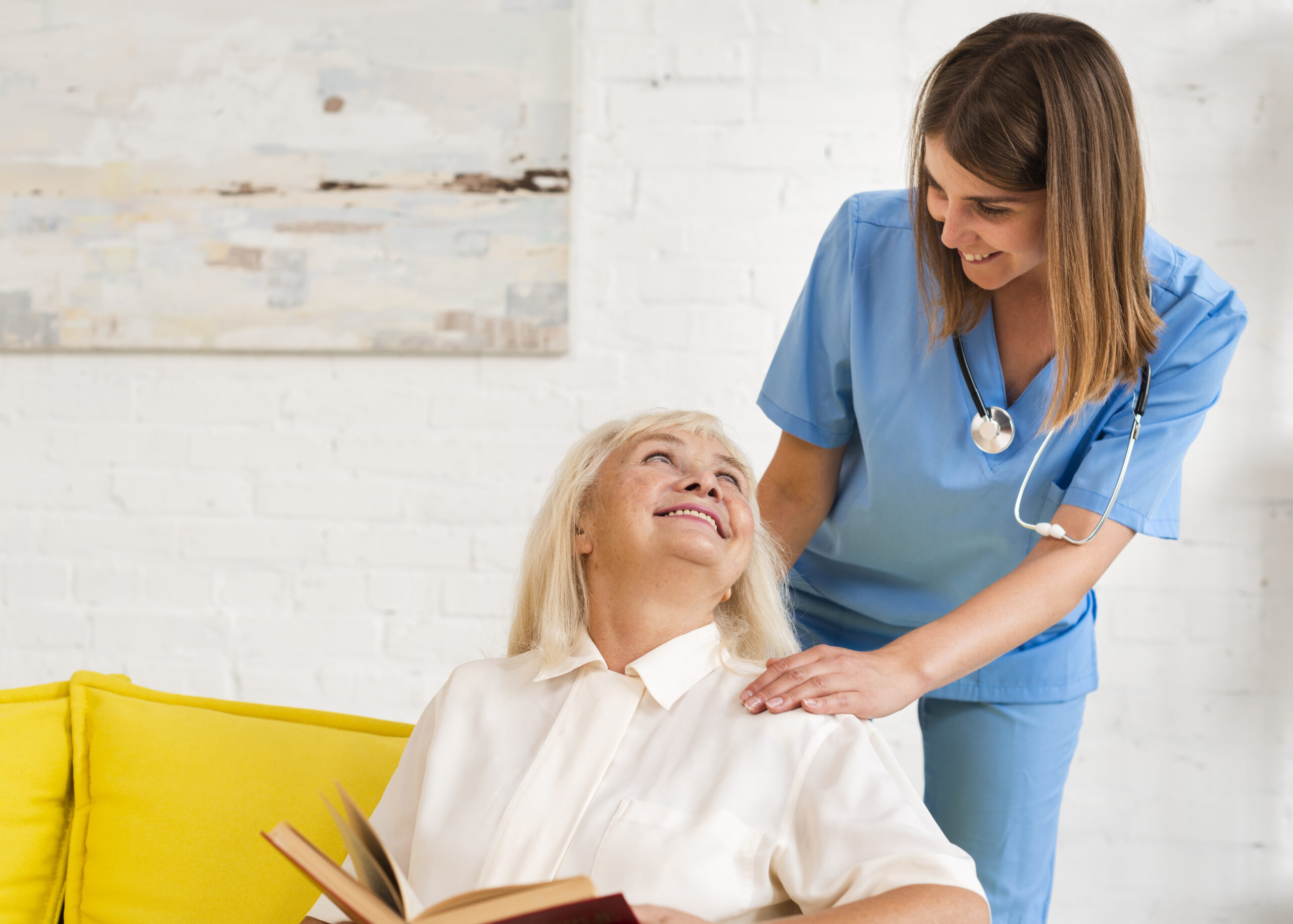 Care professional supporting a senior with memory care needs